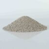 Pile of flushable spherical bentonite cat litter, highlighting its round granules and efficient absorption.