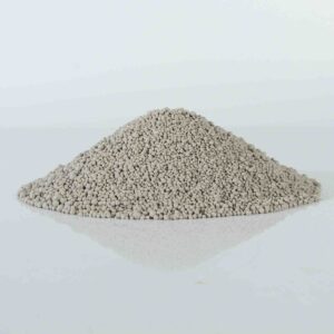 Pile of flushable spherical bentonite cat litter, highlighting its round granules and efficient absorption.