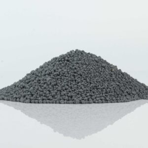 Pile of carbon spherical bentonite cat litter, showcasing its dark color and uniform spherical granules.