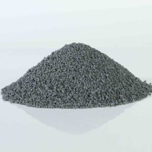 Pile of carbon granular bentonite cat litter, showcasing its dark color and uniform spherical granules.